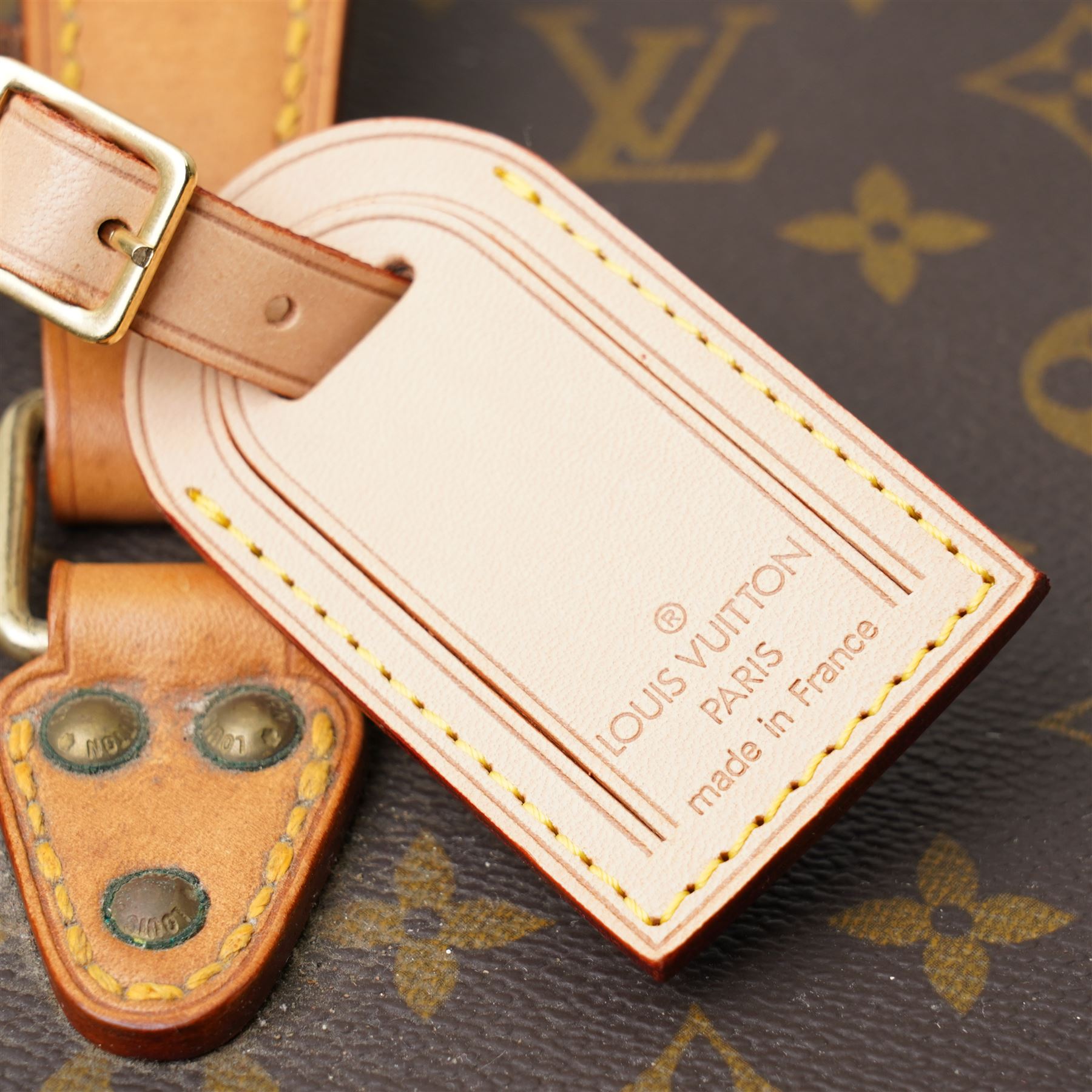 Late-20th century Louis Vuitton monogram Boîte Flacons vanity coffret, monogram canvas with lozine trim and brass mounts, single front brass lock stamped Louis Vuitton with key code 1247413, the interior fitted with leather flacon retaining loops and lift-out lidded tray with leather handle, label to interior printed Louis Vuitton Paris serial number 1045768, together with two keys stamped with matching serial numbers to the lock and luggage tag, circa late 1990s-early 2000s