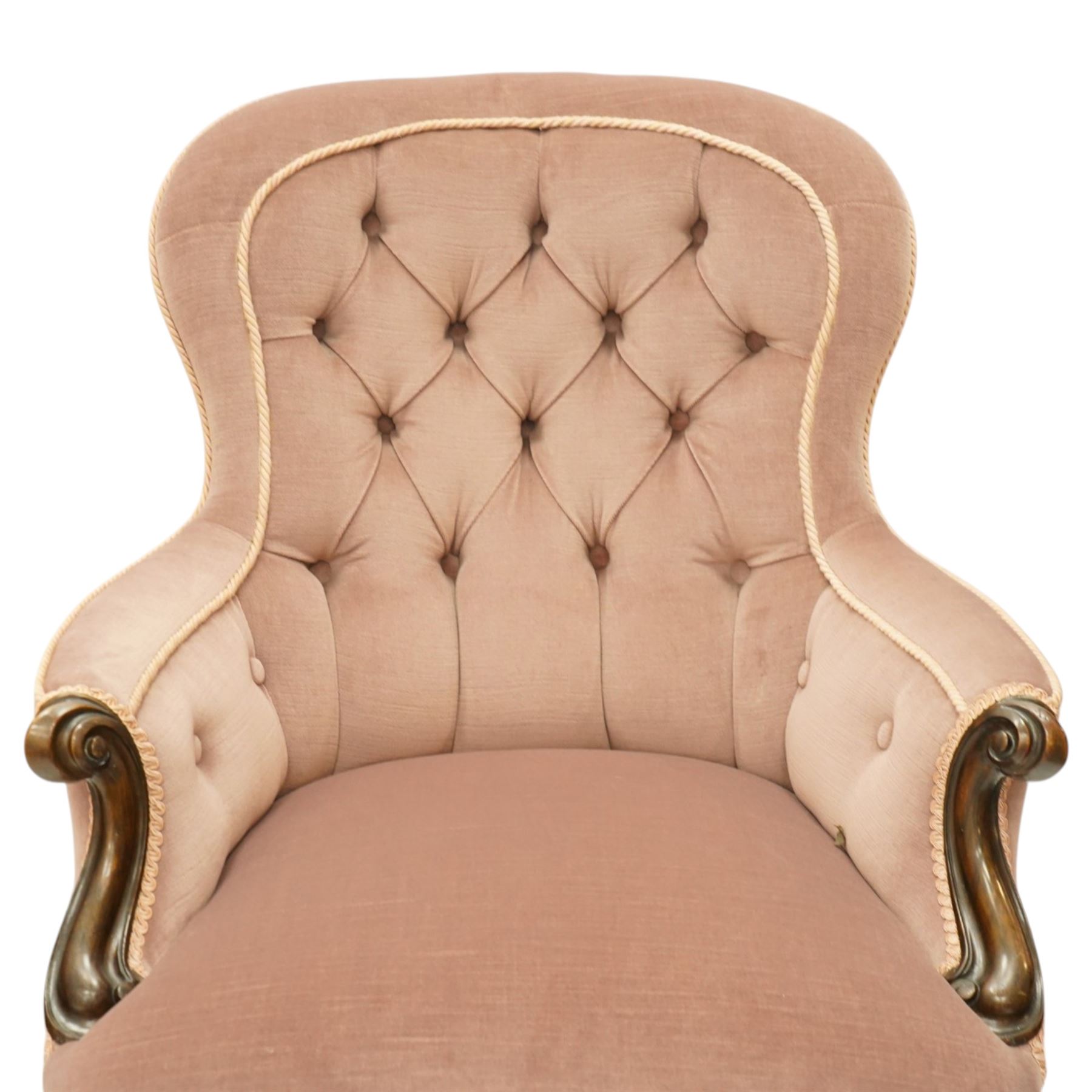 Pair of Victorian mahogany framed salon armchairs, spoon-back and sprung seat upholstered in buttoned lavender velour fabric with pink piping, shaped apron on cabriole legs with scroll feet and ceramic castors