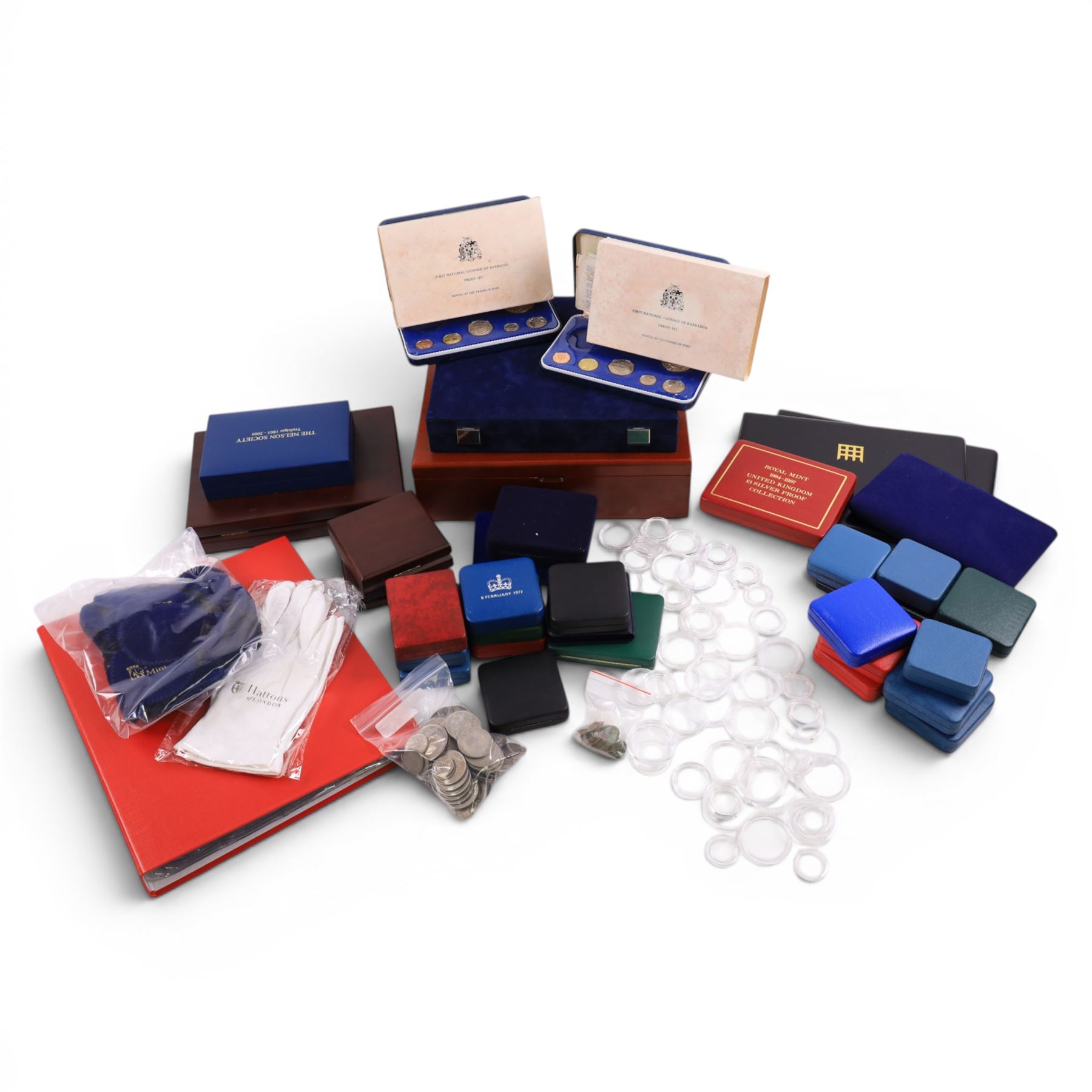 Large quantity of empty Royal Mint and Westminster coin cases, two part-filled First National Coinage of Barbados proof sets, pre-decimal coins, commemorative crowns, small group of ancient coins, Pobjoy Mint velvet bags, Hattons of London gloves, coin capsules, etc