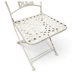 Pair of Victorian design wrought metal folding garden chairs, scrolled cresting rail over pierced foliate medallion, lattice back and seat on X-frame folding base