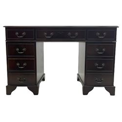 Georgian style mahogany twin pedestal desk, fitted with nine drawers, inset green tooled leather top