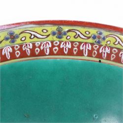 Benjarong bowl, the sides painted with alternating images of the Buddhist figures on a black ground embellished with flames, H8cm D15cm