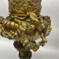 Pair of 19th century French gilt bronze wine coolers, modelled as urns with entwined fruiting vine handles and adorned with Dionysus masks, beneath a frieze depicting putti, the domed covers surmounted by recumbent putto, each upon naturalistically modelled stem and base detailed with basket of grapes and two putto at play, overall H51cm
