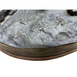 After W. Wolfe; bronze cast figural group depicting bullmastiff feeding puppies, signed with impressed mark to the front, on oval wooden base, H20cm