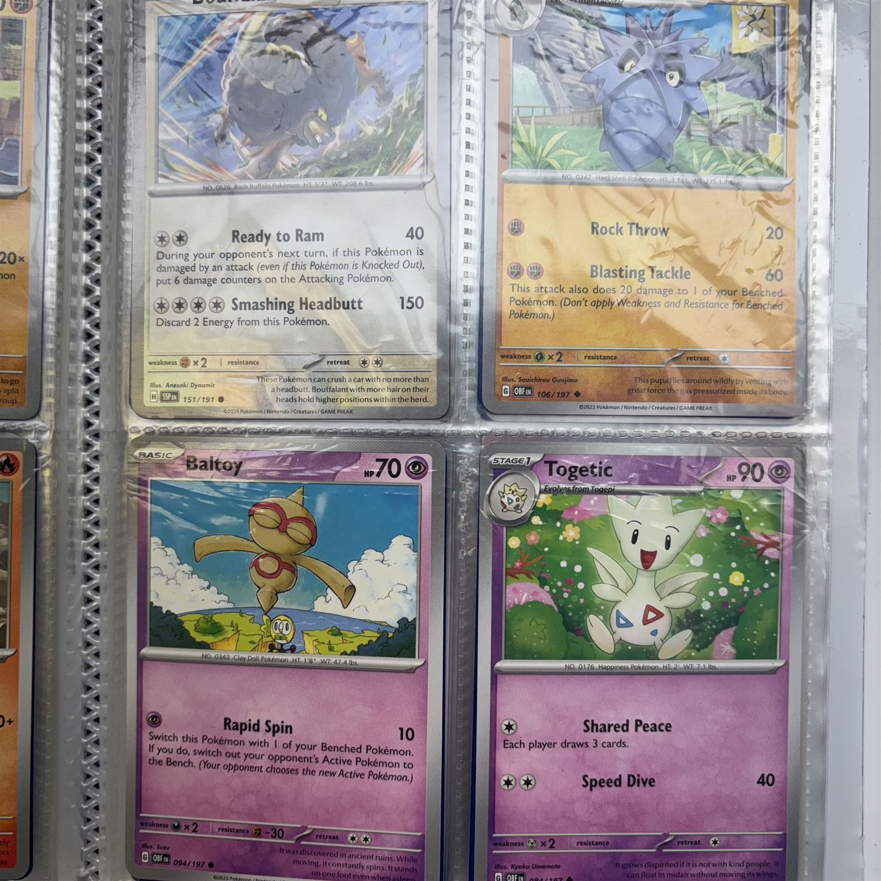 Collection of modern Pokemon TCG trading cards from the Scarlet & Violet and Sword & Shield eras, contained within in two folders, opened packets and loose, together with a graded Sword & Shield Silver Tempest Passiman TG08, GET Graded 9 Mint, two oversized cards, energy cards, vintage booklets and boxes, empty tins, 1998 Electronic Pokédex and other accessories