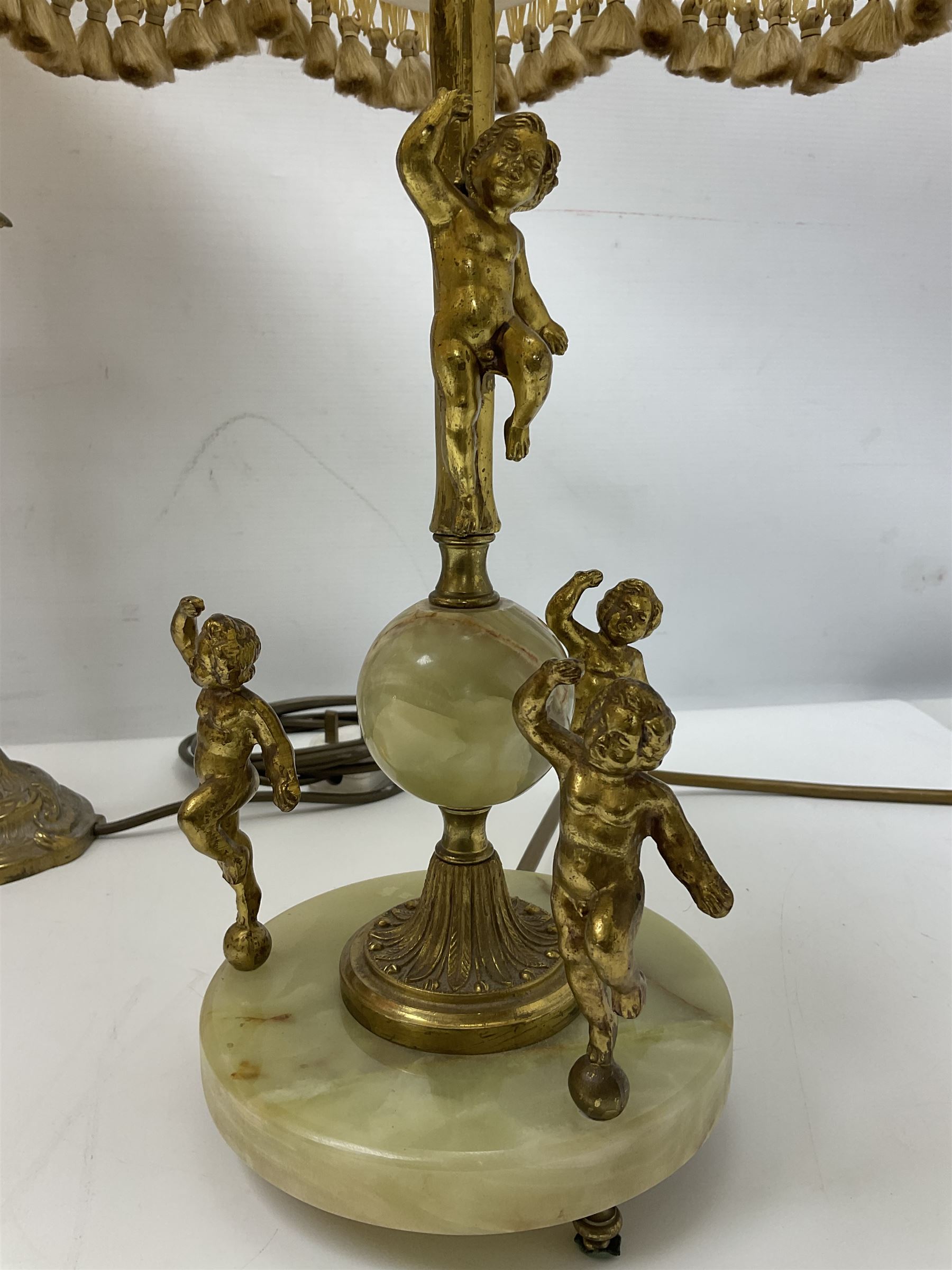Green onyx and gilt metal table lamp decorated with puttos, together with gilt jardiniere stand and two other table lamps, stand H62cm