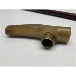 Victorian magician's cane, the mahogany walking stick twisting apart to reveal an internal mechanism, opening to tripod and black silk fold out magician's table, with horn handle and silver mount, hallmarked Birmingham 1891