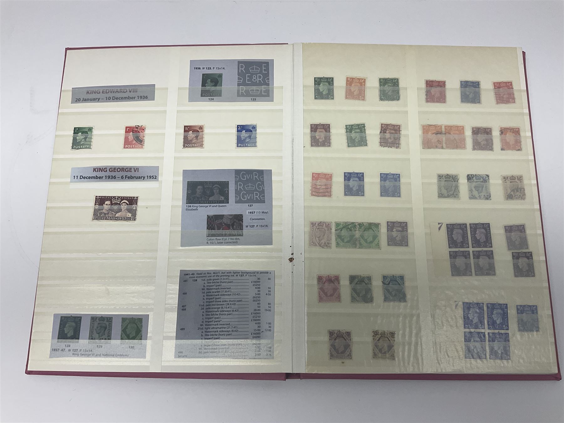 Mostly Great British stamps, including King Edward VII two shillings and sixpence, five shillings and ten shillings, King George V seahorses, King George VI high values, Queen Elizabeth II pre and post decimal etc, housed in a pink stockbook 