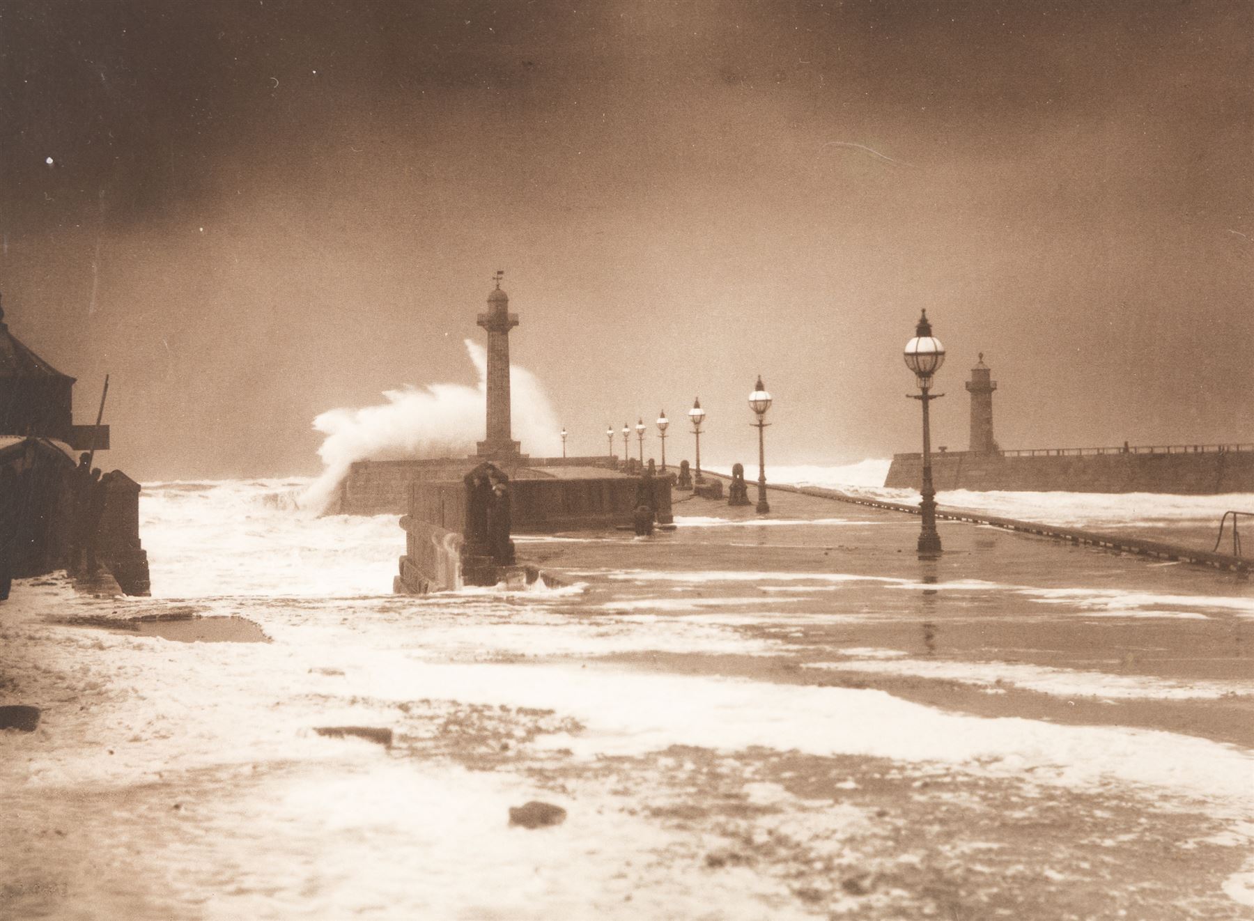 After Frank Meadow Sutcliffe (British 1853-1941): High Seas on Whitby's West Pier, photographic print unsigned 19.5cm x 26cm