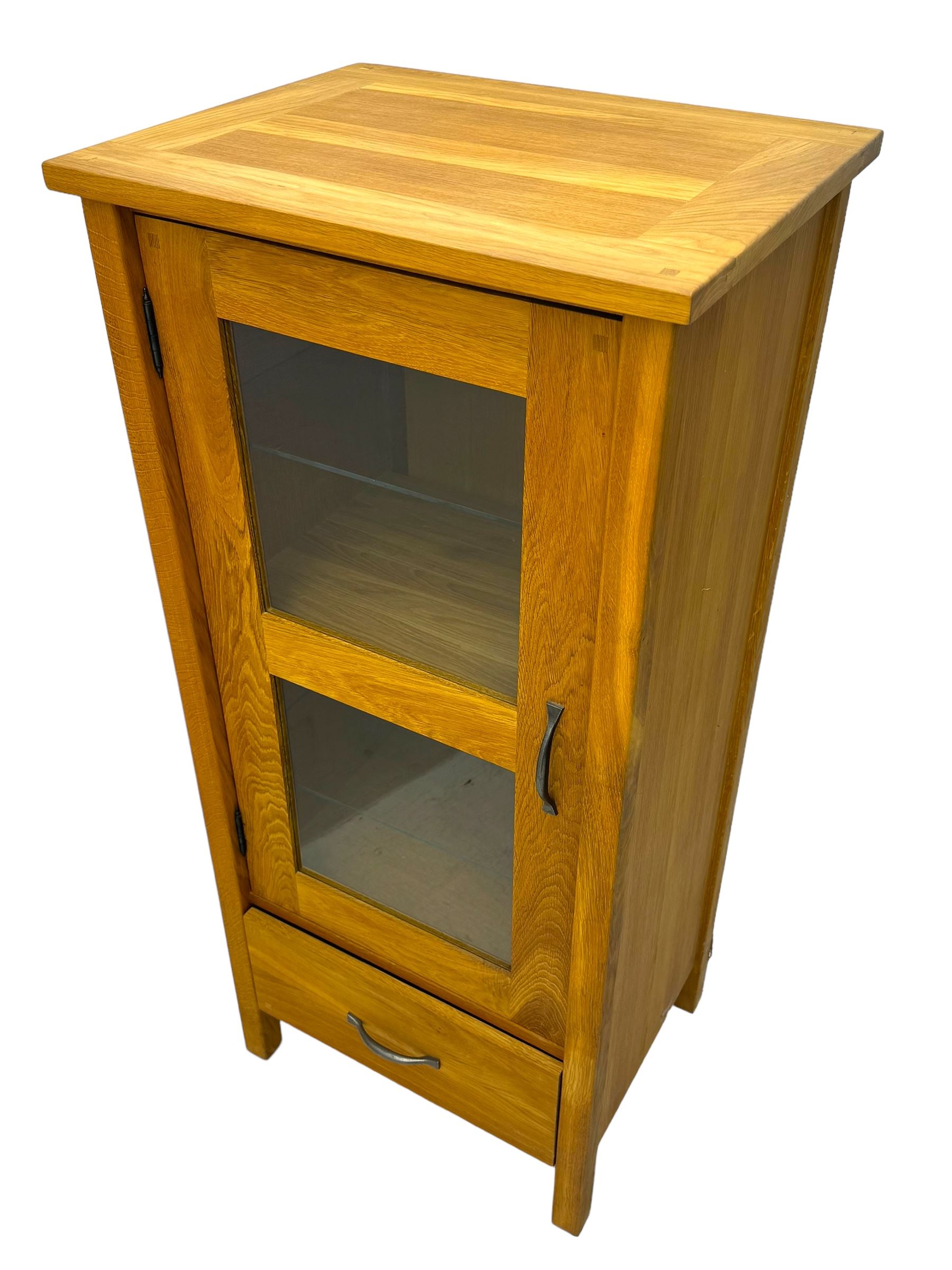 Laura Ashley - contemporary Milton oak display cabinet, featuring single door with two glass panels and pewter effect handle, enclosing one fixed oak shelf and two adjustable glass shelves, access hole at the bottom shelf, over single drawer with matching handle, on square legs