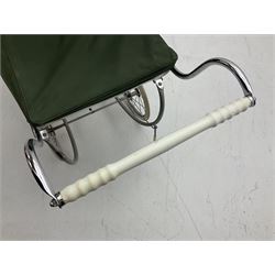 Silver Cross coach-built doll's pram with green fold-down hood and cover, sprung tubular frame, chrome and white handle, four spoked wheels with brake, mattress, pillow and bedding L97cm