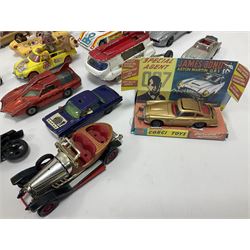 Various makers - large quantity of unboxed, playworn, incomplete and repainted TV and film related die-cast models including Dinky Maximum Security Vehicles, Corgi 007 Moonbuggys, USS Enterprise, Corgi James Bond Aston Martin and other vehicles, Corgi Magic Roundabout, Chitty Chitty Bang Bang, Batmobile etc, SPV, Basil Brush etc