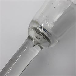 Three 18th century wine glasses comprising a plain stemmed glass with bell shaped bowl and conical folded foot H16cm, another plain stemmed glass with ogee bowl and folded foot and a Continental glass with gilt faceted bowl, decorated with male figure within a landscape, on a clear Silesian seven sided cut stem (3)