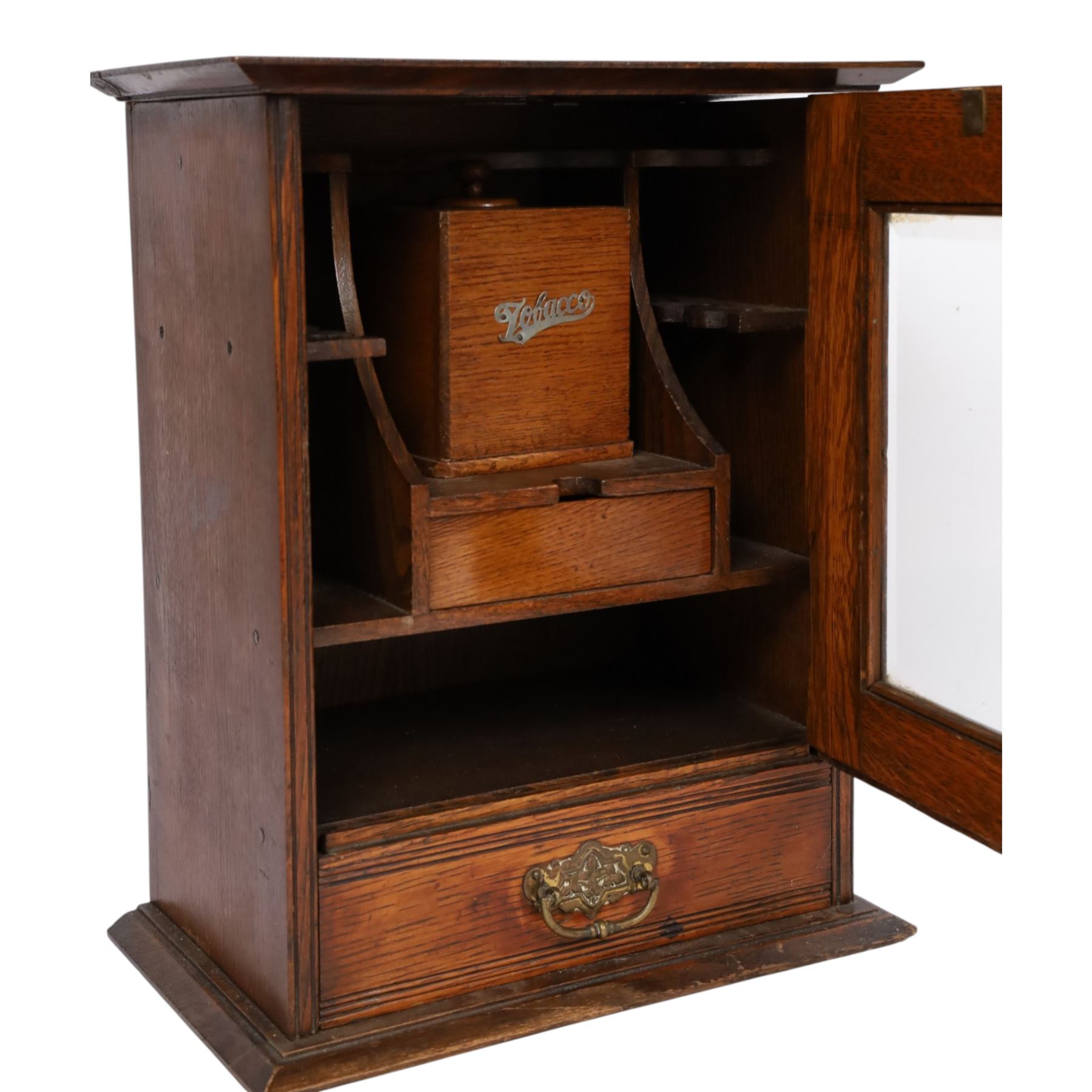 Oak smoking cabinet, with hinged lid, the glazed door opening to reveal a fitted interior, over a single drawer, together with a wooden tobacco box with lid, cabinet H39cm