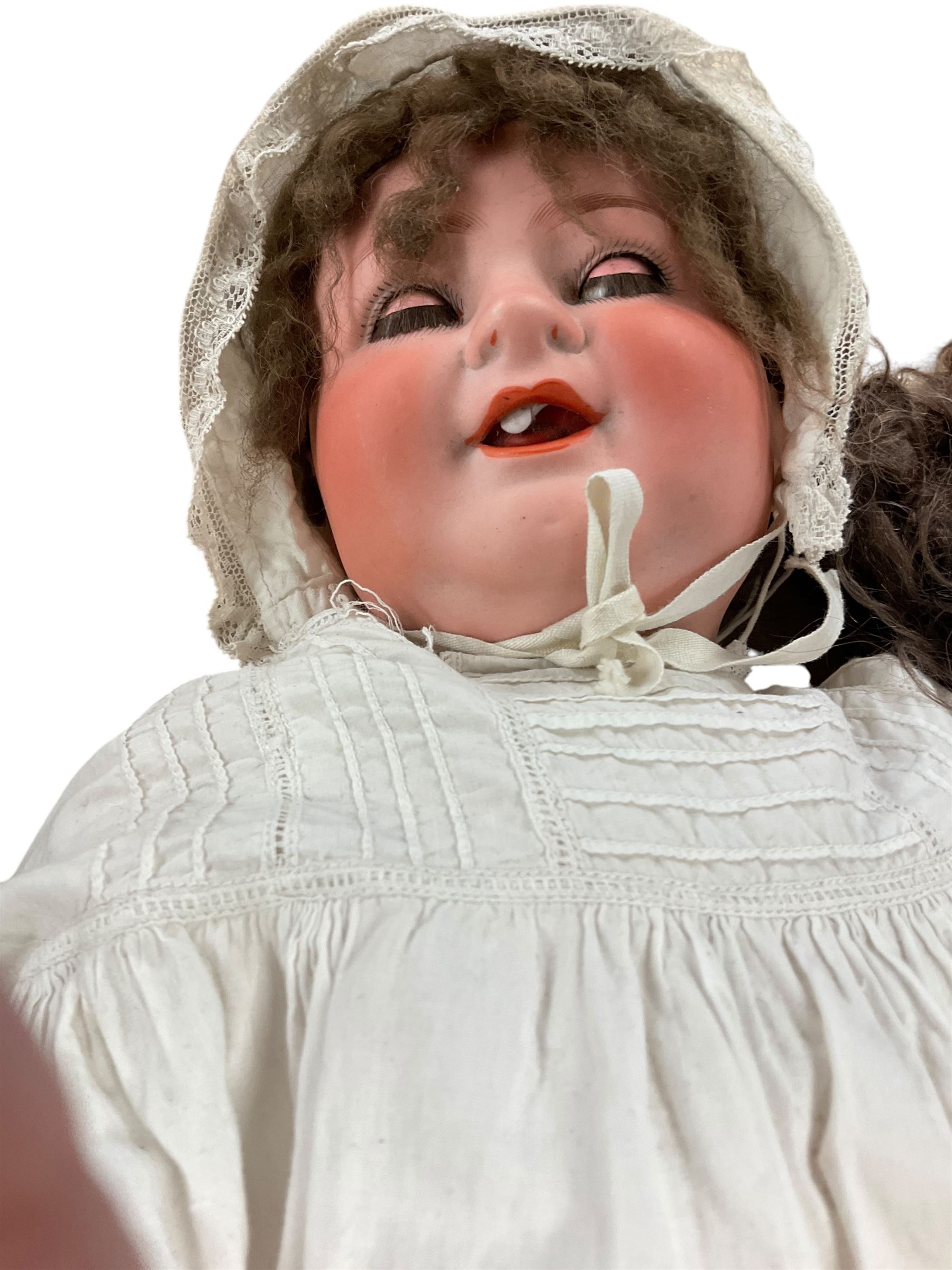 Two German porcelain dolls with moveable limbs