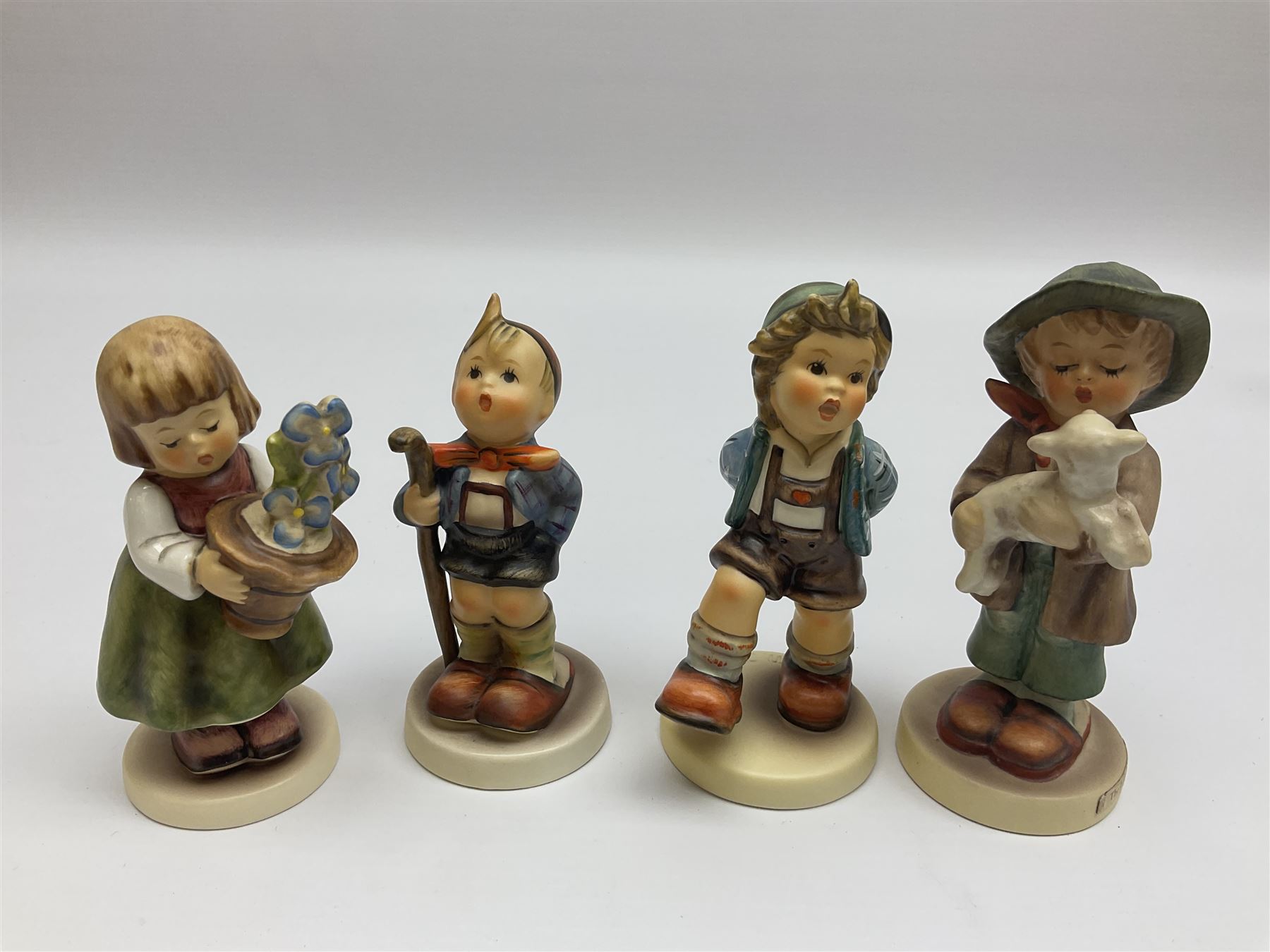 Twenty six Hummel figures by Goebel, to include Fire Fighter, Band Leader and Spring Sowing