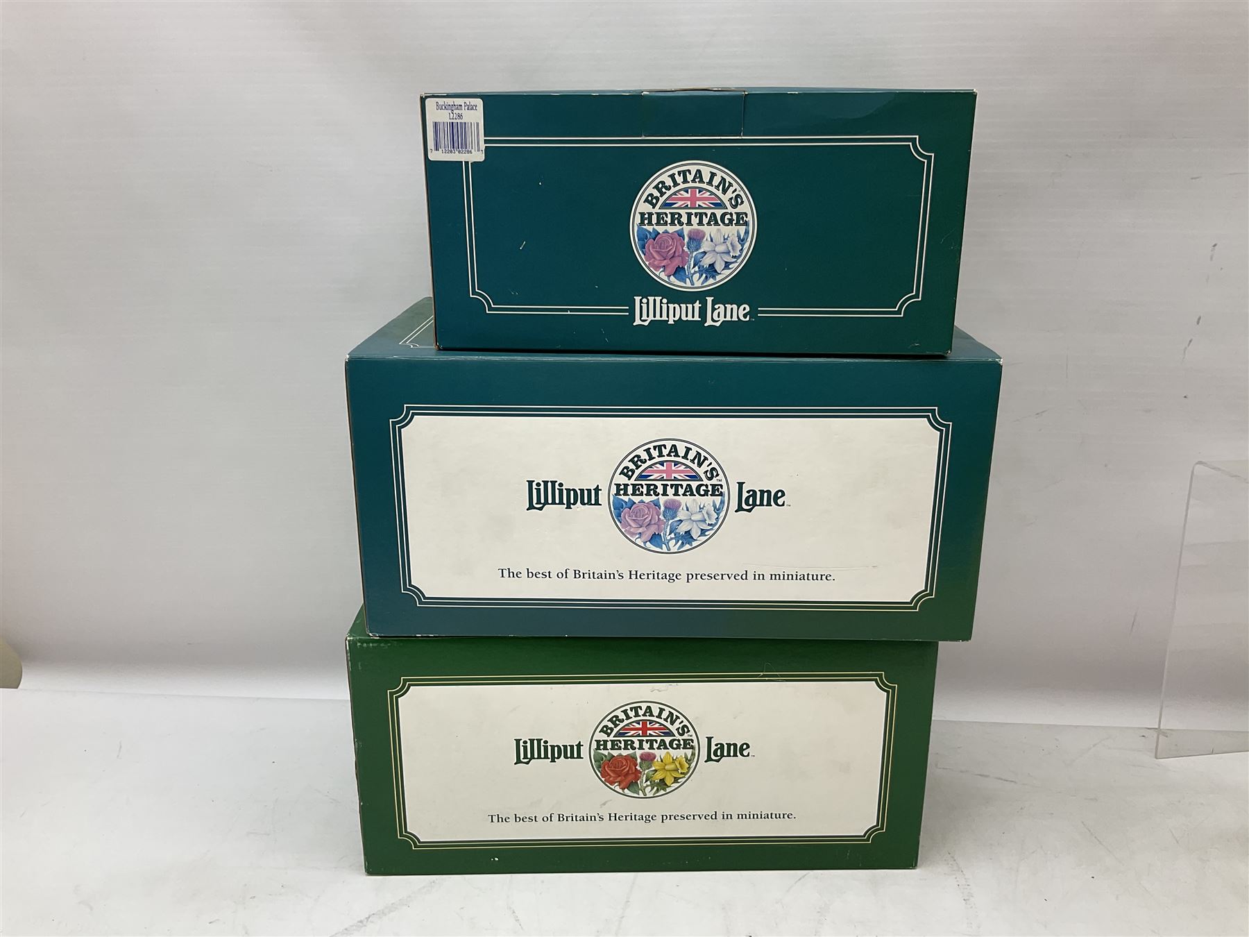 Three Lilliput Lane models from the 'Britain's Heritage' collection, comprising The Royal Pavilion Brighton, St Paul's Cathedral and Buckingham palace, all boxed
