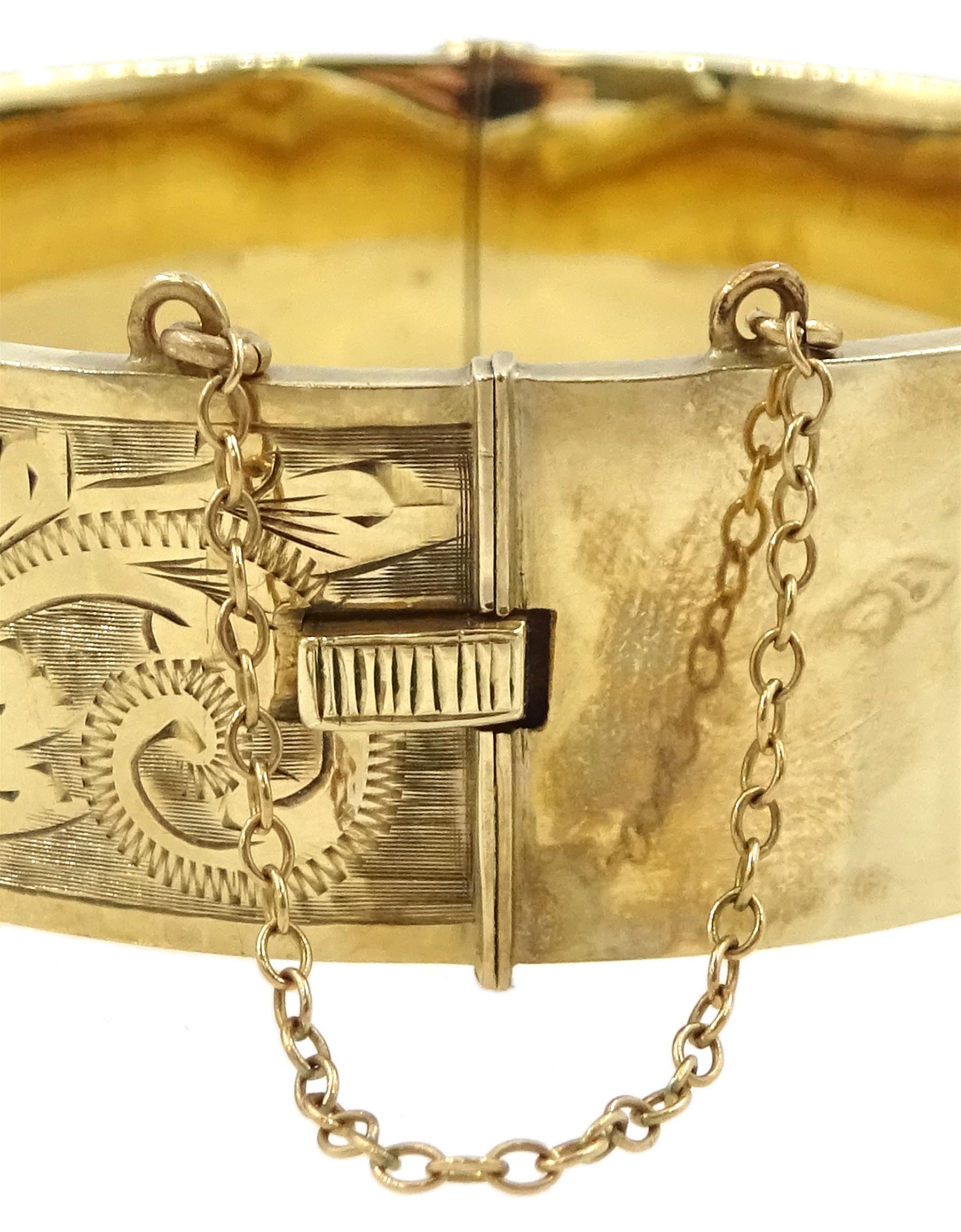 9ct gold hinged bangle with bright cut decoration by Henry Griffith & Sons Ltd, Birmingham