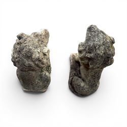 Pair of cast stone garden lions, seated on rectangular plinths