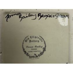 Lorna Bailey Old Ellgreave Pottery, comprising teapot in beach design, circular jar in house and path design, shell jug in Bridge and stream design, squat jug in Pagoda design and plate decorated with an Art Deco woman, all with printed and painted marks. 