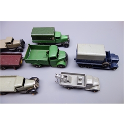  Dinky - eight unboxed and playworn early die-cast commercial vehicles including breakdown truck, tipper trucks, covered wagons etc and two trailers  