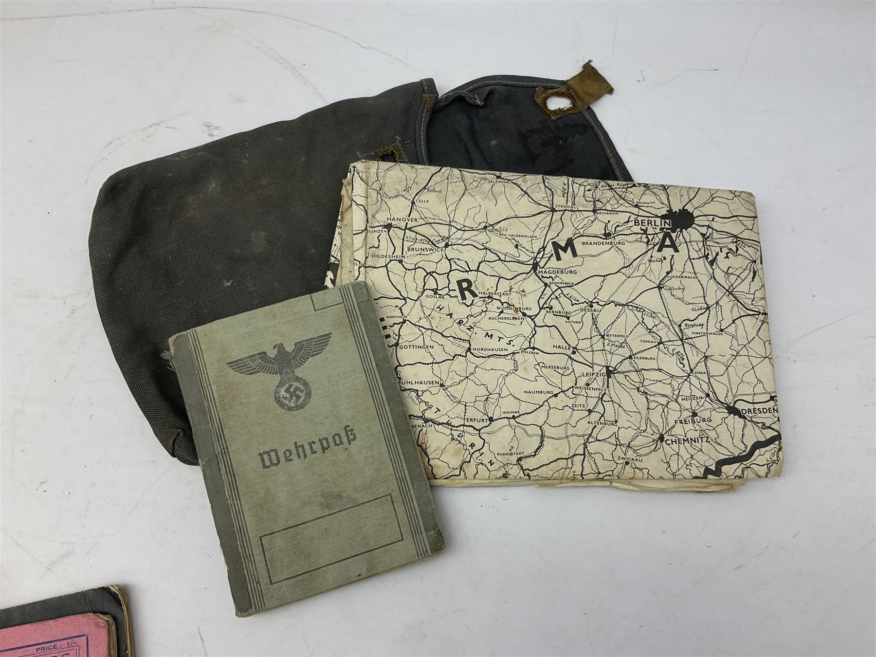 WW2 German War Pass (Wehrpass) identification paperwork for Walter Fensterseifer 2nd type booklet dated 8/6/1940, with signed photo of recipient in civilian suit. Born 31st January 1921. Numerous entries; together with quantity of small private photographs of German soldiers; One Million mark banknote 1923; 30th Corps in Germany booklet with Formation badge; and other WW2 paper ephemera