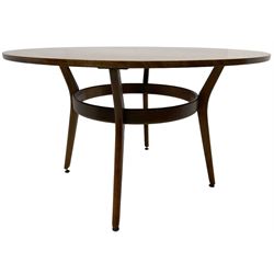 Mid-20th century circa. 1960s teak dining table, circular top on splayed supports