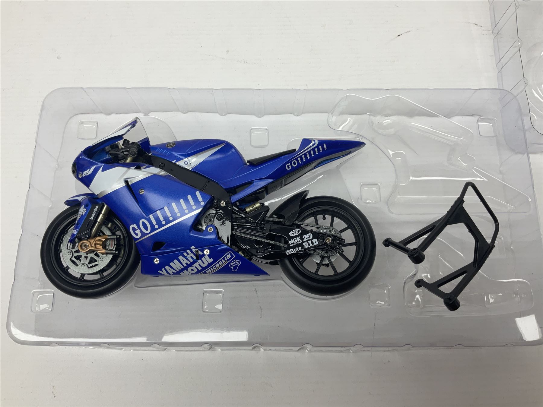 Three Minichamps 1:12 scale die-cast models of motorcycles - Suzuki GSX-R1000 Team Alstare Suzuki Corona Extra Troy Corser WSB 2005; Yamaha YZR-M1 Gauloises Yamaha Team Colin Edwards MotoGP Laguna Seca 2005; and Honda NSR 500 Loris Capirossi MotoGP 2002; all boxed (3)
