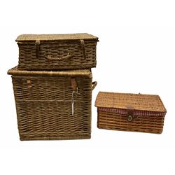 Two wicker picnic baskets with hinged lids, together with a small wicker blanket chest with twin handles H46cm, L47cm. 