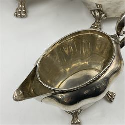 Five piece Edwardian silver tea service, comprising teapot and coffee pot, each with ebonised scroll handle, tea caddy with hinged cover, twin handled open sucrier, and milk jug, each of rounded bombe form, upon four paw feet, hallmarked William Adams Ltd, Birmingham 1904 and 1905, coffee pot H26cm
