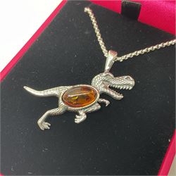 Silver Baltic amber dinosaur pendant necklace, stamped 925 