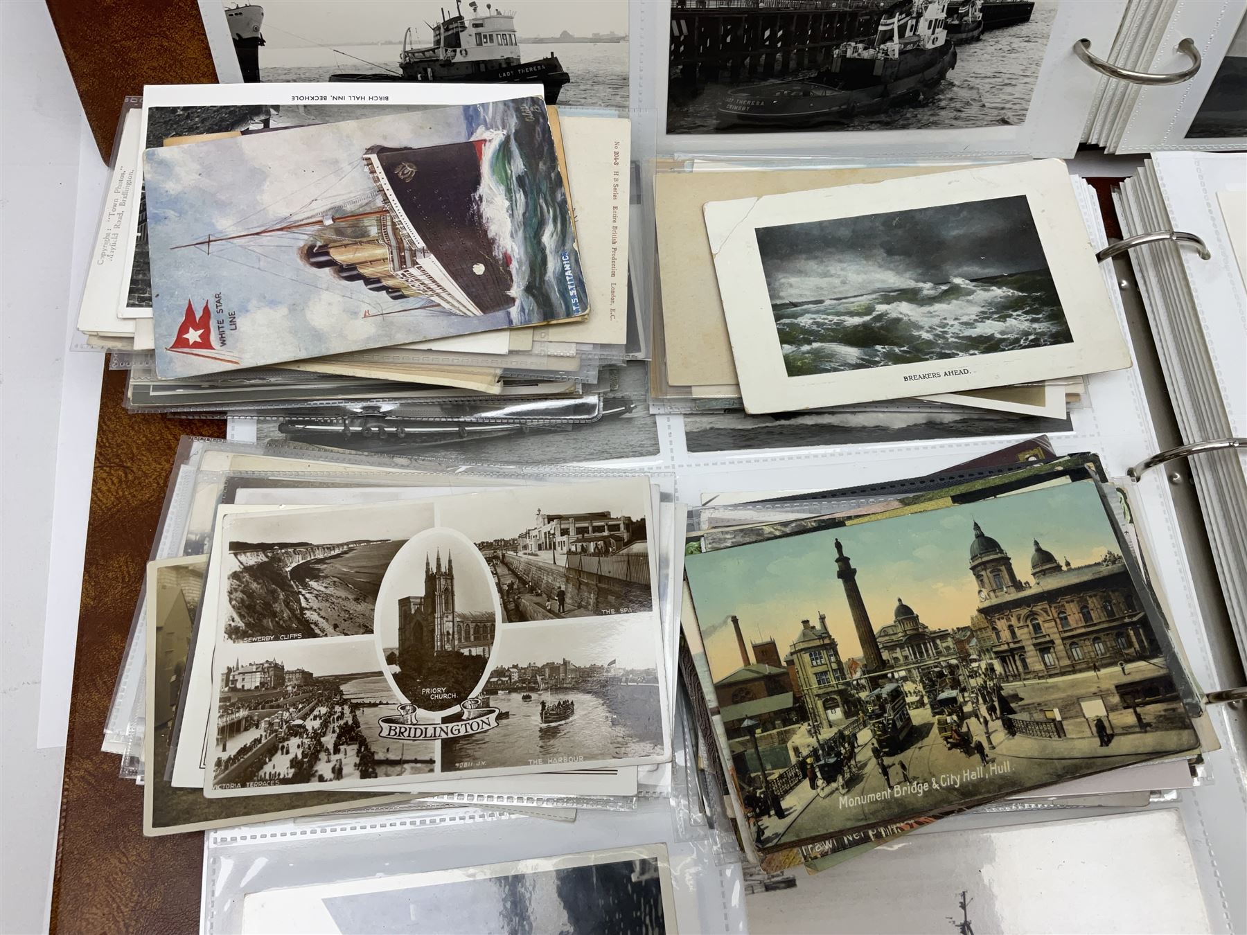 Collection of loose Edwardian and later postcards, mostly topographical examples depicting East Yorkshire, Hull and the East Coast, including Hull, Bridlington, Staithes, Flamborough Head, Beverley, etc., and a quantity of other postcards, plus two photograph albums containing photographs of trawlers