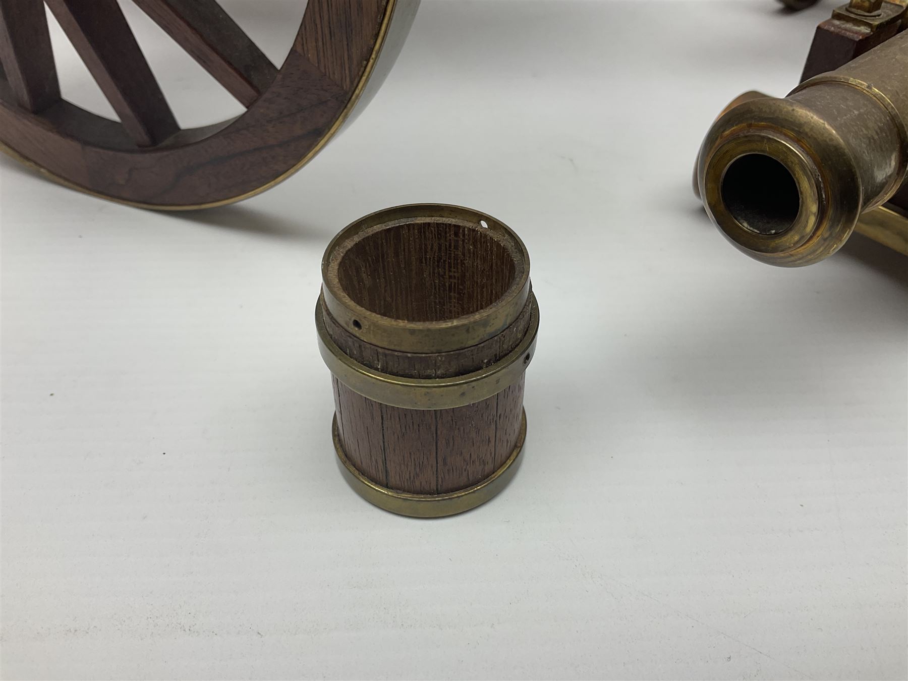 Large model brass cannon, upon wooden base, together with two similar smaller cannons, largest L48cm