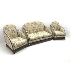 Art Deco period mahogany framed two seat settee, upholstered in a beige ground studded fabric with floral field (W134cm) and two matching armchairs (W66cm)