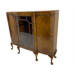 Mid 20th century figured walnut display cabinet, curved ends with centre glazed door, on cabriole feet