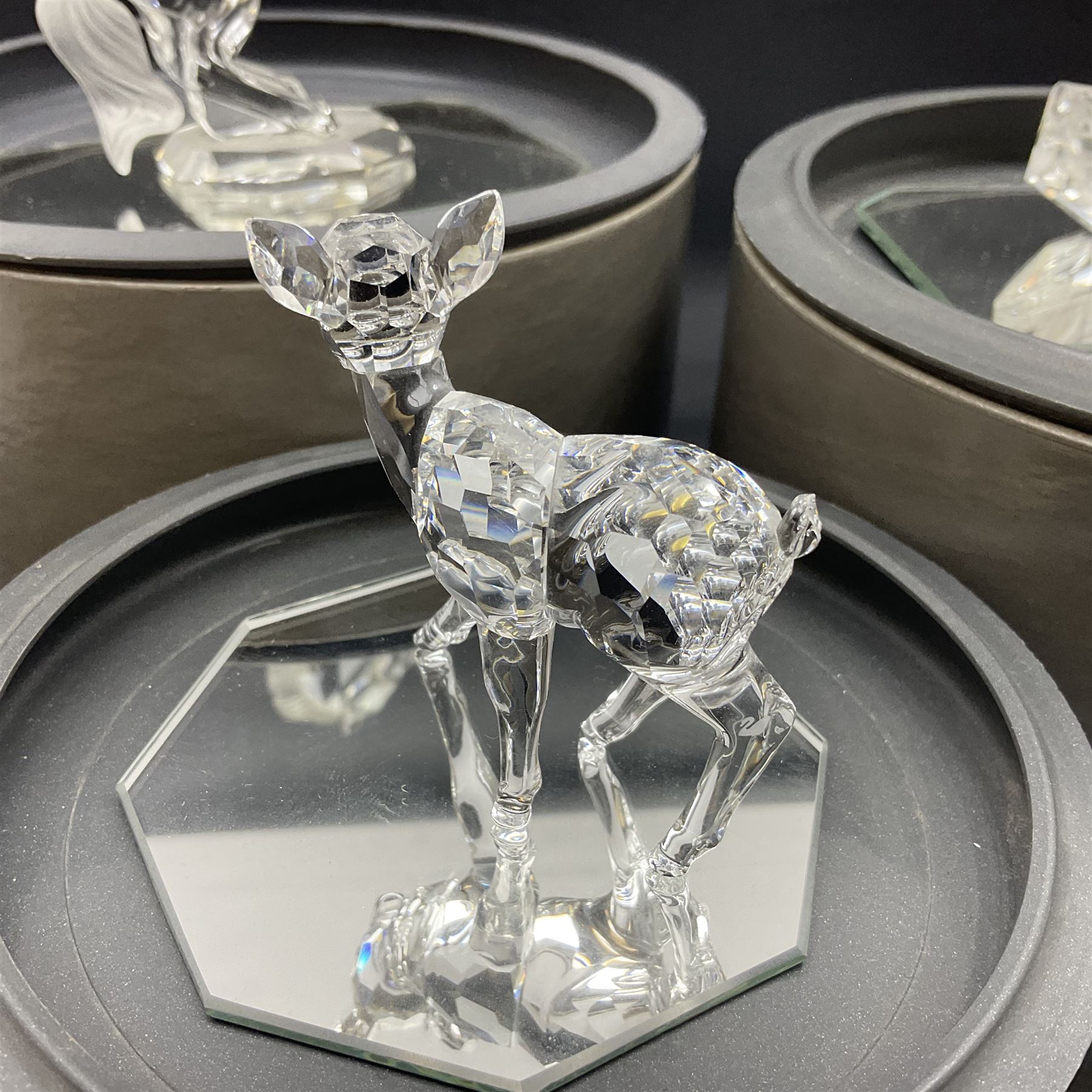 Five Swarovski Crystal figures, comprising giraffe, deer, hummingbird, rose and rearing horse, all with original boxes 