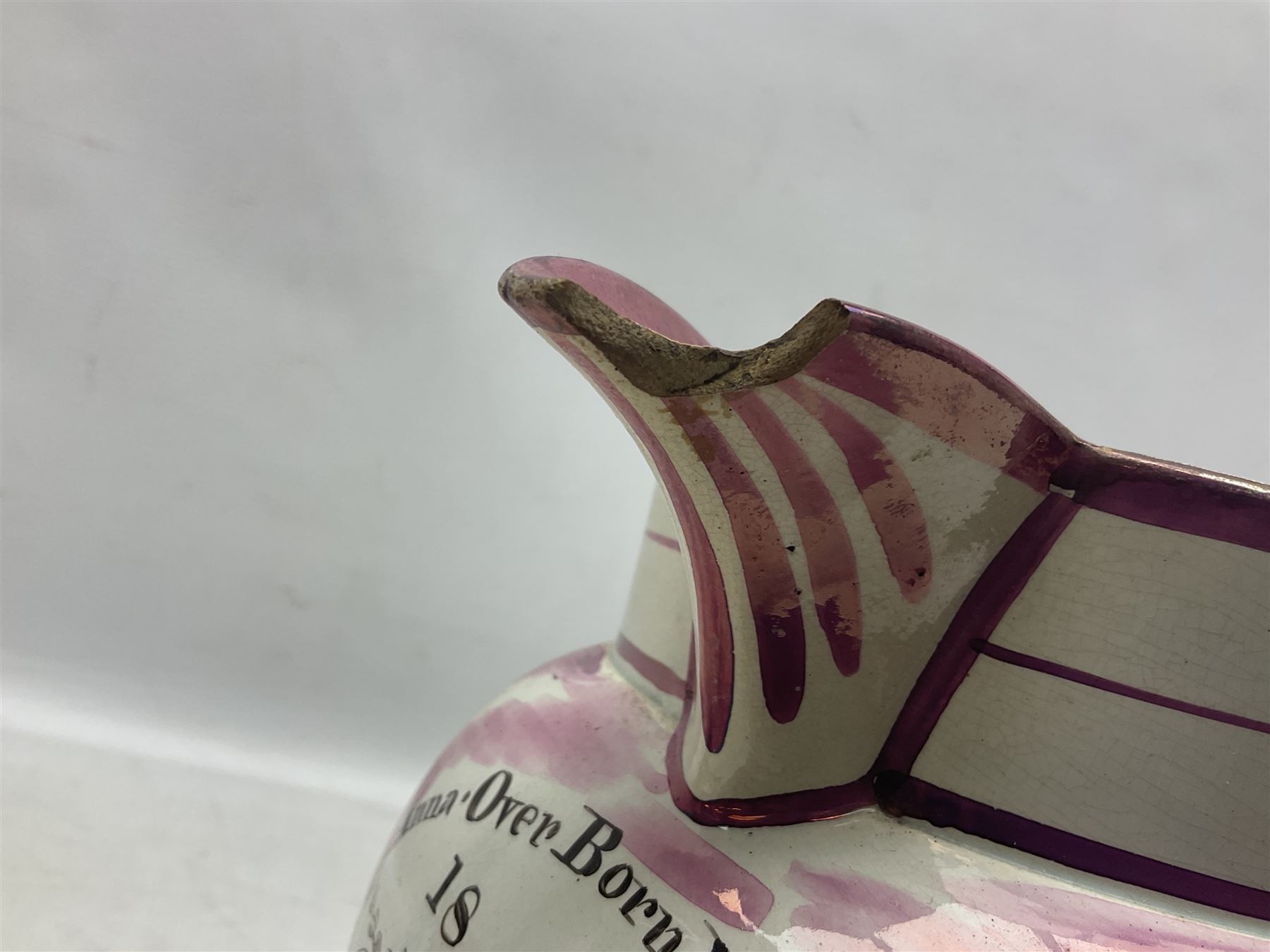 Early 20th century Sunderland lustre jug, decorated with transfer Masonic scene and poem 'The World is in Pain/Our Secrets to Gain/But Still Let Them Wonder and Gaze/The Never Can Divine/The World Nor The Sign/Of a Free and Accepted Mason', the reverse decorated with Sunderland River Wear cast iron bridge scene below text (a/f), together with a copper lustre jug, and pink lustre bowl, jug H20cm