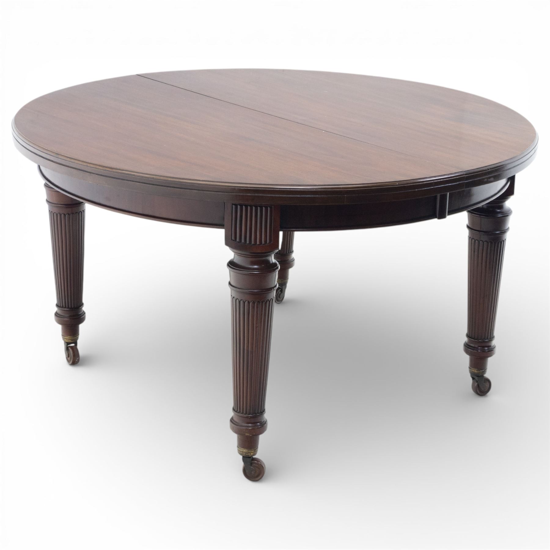 Spillman & Co. London - large Victorian mahogany extending dining table with three additional leaves, upon turned and reeded supports with ceramic castors, bearing ivorine label beneath detailed 'Spillman & Co. St. Martins Lane, London', extends to 302cm
