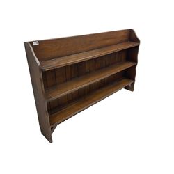 Oak three heights open bookcase, shaped end supports and plank back