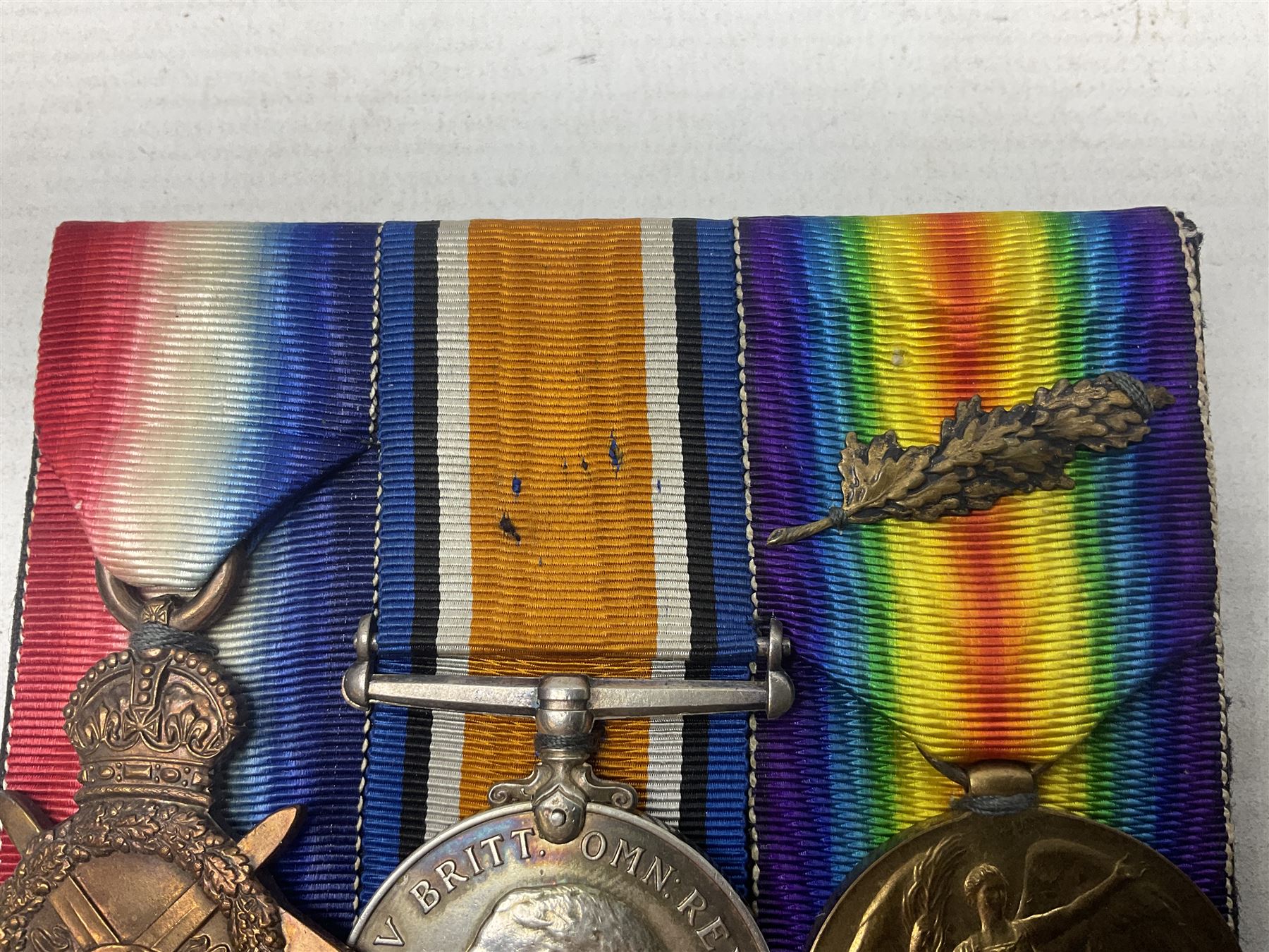 WW1 group of three medals comprising 1914-15 Star awarded to 536 Pte. T. Hall North'd Yeo. and British War Medal and Victory Medal with oak leaves awarded to 2.Lieut. T. Hall; with ribbons; displayed on board for wearing; some biographical details