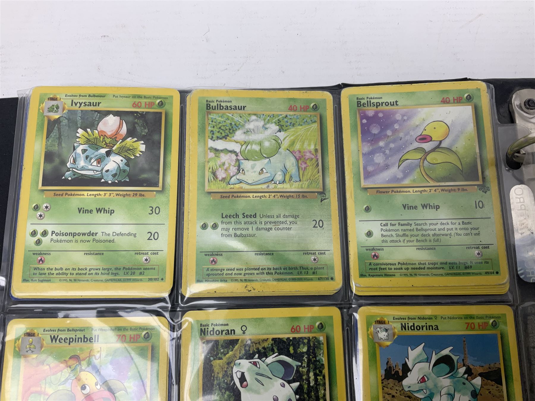 Collection of Pokemon trading cards, mostly 1999 Wizards Pokemon cards to include holo Charizard 4/102, first edition holo Machamp 8/102, further holographic cards; Dark Flareon 35/82 and Dark Vaporeon 45/82, cards from themed sets and 4th edition prints; 1998 Electronic Pokédex with cardboard boxes for themed decks Blackout, Overgrowth and Power Reserve Jungle, along with a large quantity of energy and trainer cards 