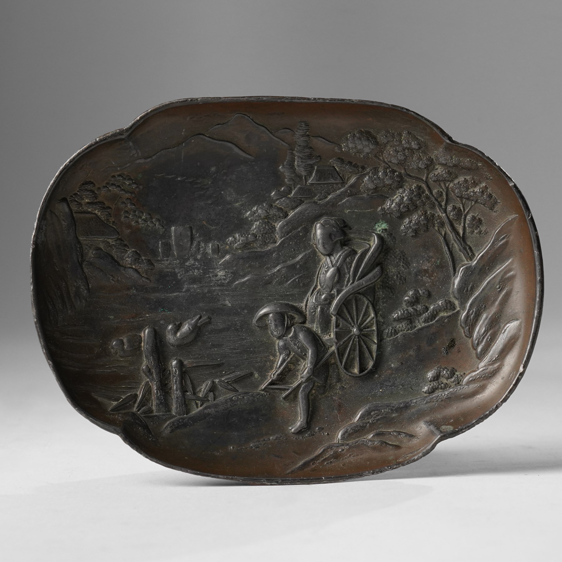 Japanese bronze tray, decorated in relief with two travellers in a landscape, W15cm 