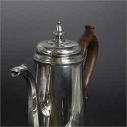 George II provincial silver coffee pot, of tapering cylindrical form, with wooden scroll capped handle, hinged cover with bell finial, and engraved crest to body, hallmarked John Webber of Plymouth, Exeter 1759, H21cm