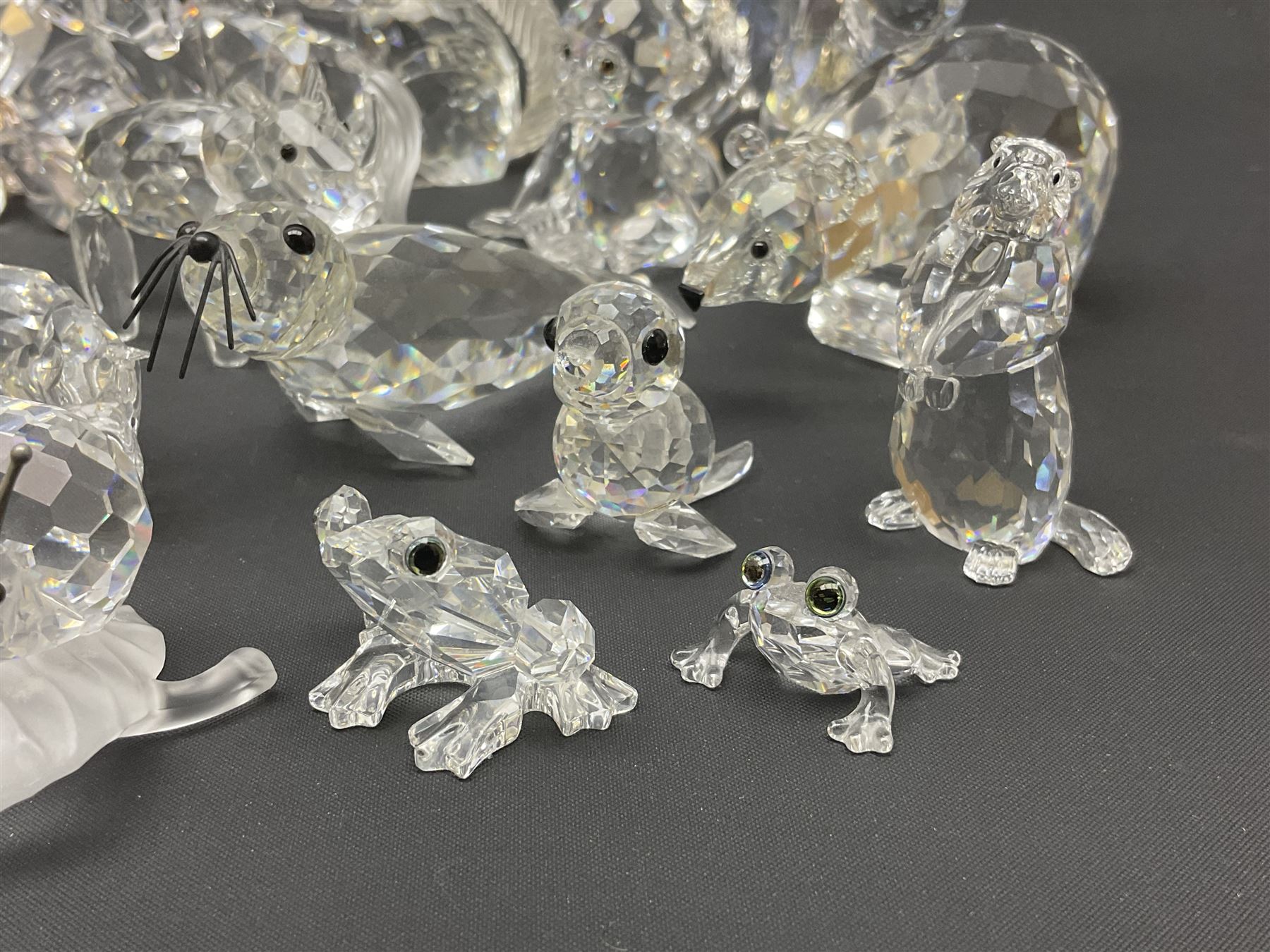 Twenty nine Swarovski Crystal animals, to include koala and baby, in frosted tree branch, elephants, polar bears, squirrel, monkeys, panda, unicorn and snails, etc 