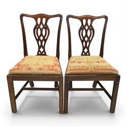 Large 19th century mahogany extending dining table with set of Chippendale design chairs, extending dining table with rectangular moulded top additional three leaves, raised on turned supports terminating in brass castors, the dining chairs (2 + 2) with shaped cresting rail and pierced splats, raised on square supports with stretchers
