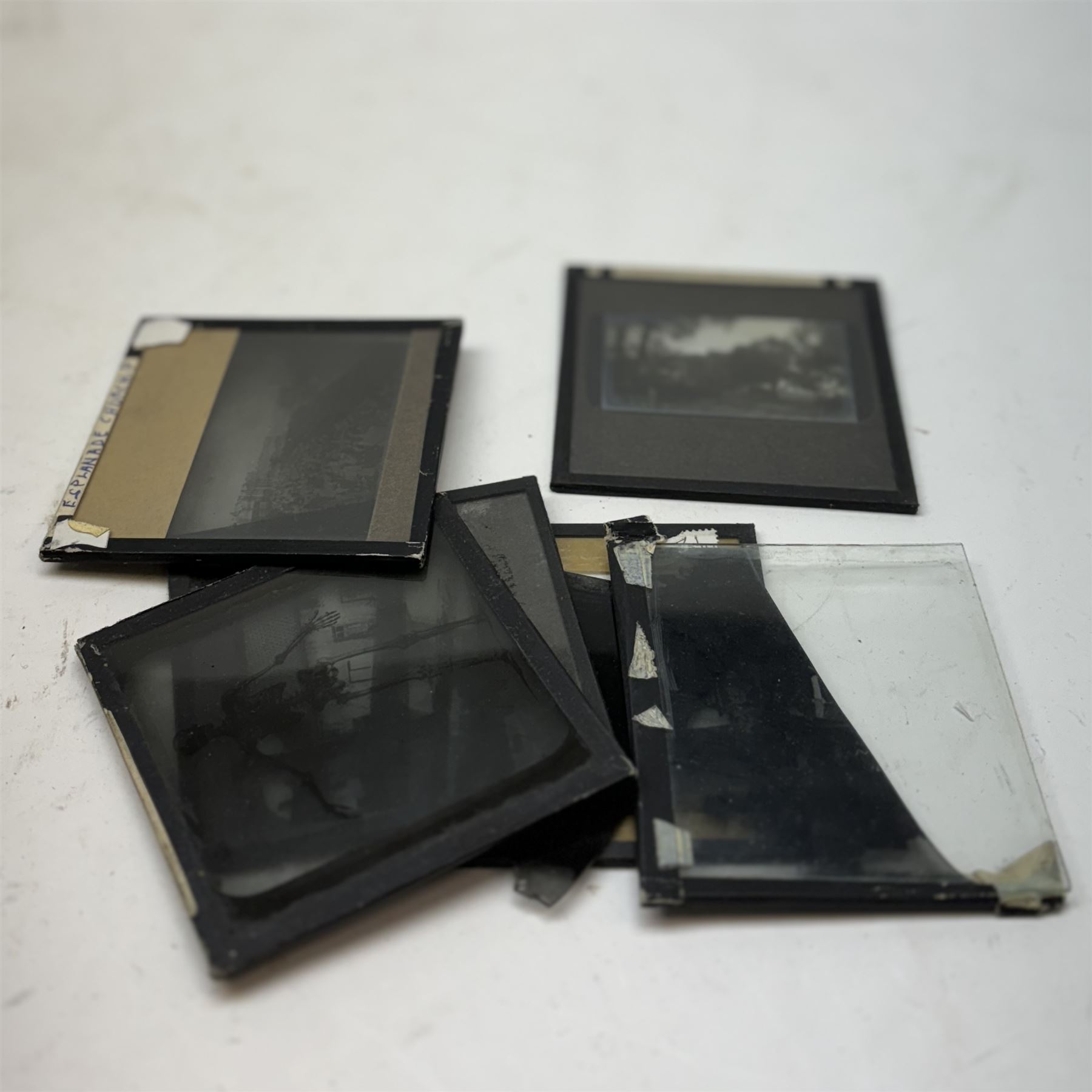 Collection of magic lantern slides, including examples by Graystone Bird of Bath and scenes of Old Scarborough, in wooden box