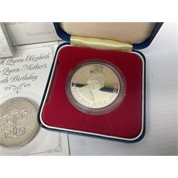 Queen Elizabeth II 1977 silver crown and 1980 silver crown, both cased with certificates, Bailiwick of Guernsey 1978 silver crown cased without certificate, three United Kingdom brilliant uncirculated five pound coins in card folders and twelve other five pound coins