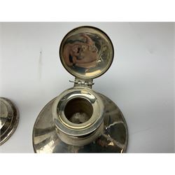 1920's silver mounted capstan inkwell, hallmarked Charles Boyton & Son Ltd, London 1929, together with an early 20th century silver mounted dwarf candlestick, hallmarked A J Pepper & Co, Birmingham 1918