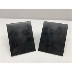 Pair of black marble book ends of triangular form, H11cm 