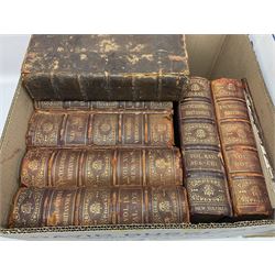 Thirty six volumes of Encyclopaedia Britannica with gold tooled red leather spines in various editions 